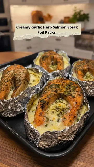 Creamy Garlic Herb Salmon Steak Foil Packs Tender salmon steaks baked in foil wi