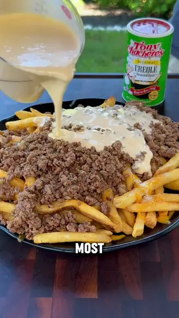 These loaded fries are absolutely loaded with crispy bacon, seasoned ground beef