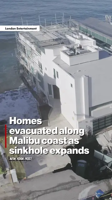 An aerial video shows waves crashing into seaside homes in Malibu on Sept. 8, 20