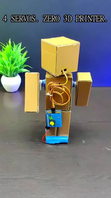 This started as a flat stack of cardboard and four cheap servo motors — and now 