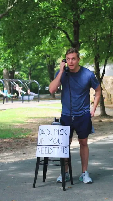 We put a phone in the middle of a park with a simple sign: “DAD, PICK UP. YOU NE