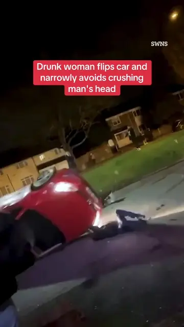 This is the moment a drunk woman flipped her car outside a pub before narrowly a