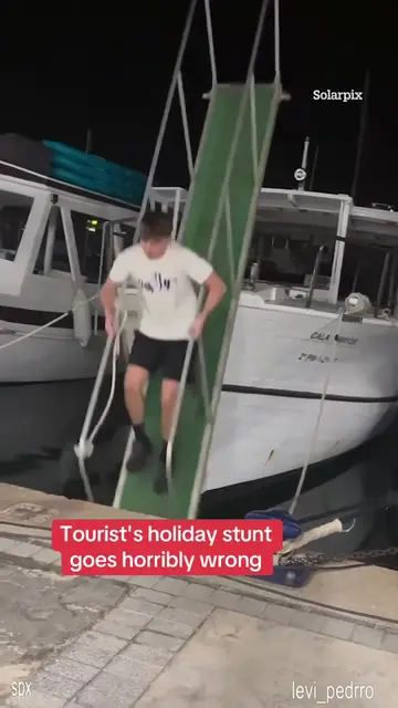 This is the moment a tourist plunges into the water after his holiday stunt goes