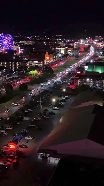Neon lights, mountain nights. ⛰️✨ There is something unreal about Pigeon Forge a