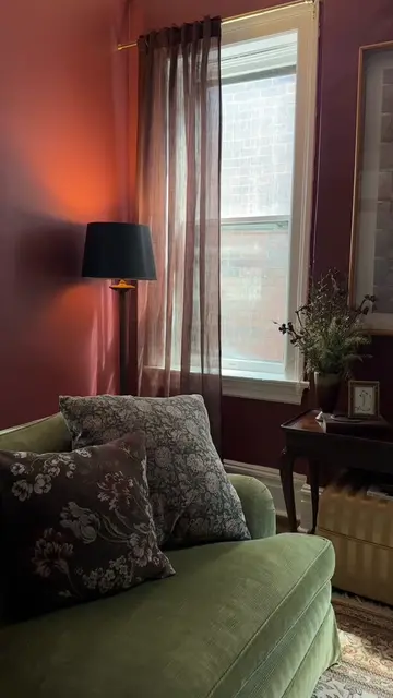 the coziest room in our apartment! love some good complimentary colors ♦️🫒📌🪲 