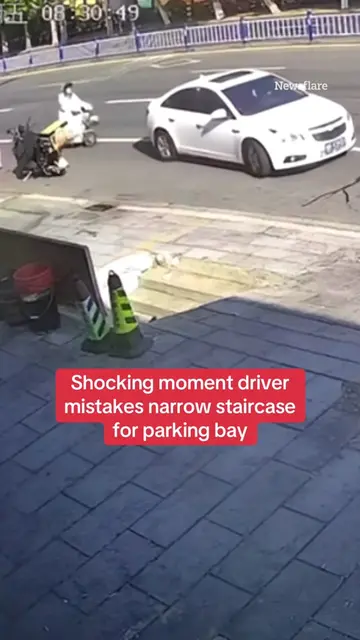 This is the shocking moment a driver mistakes a narrow staircase for a parking b