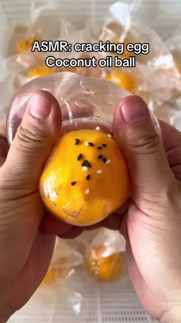 Coconut oil filled, cracking egg hand made ball 🐣#squishy #squishes #asmr #fyp 