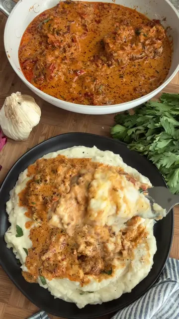 The ultimate comfort food….smothered chicken thighs over creamy mashed potatoes!