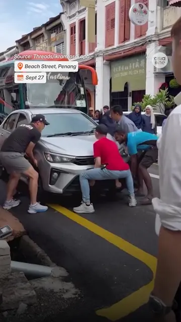 The car — parked along a single yellow line during prohibited hours — was obstru