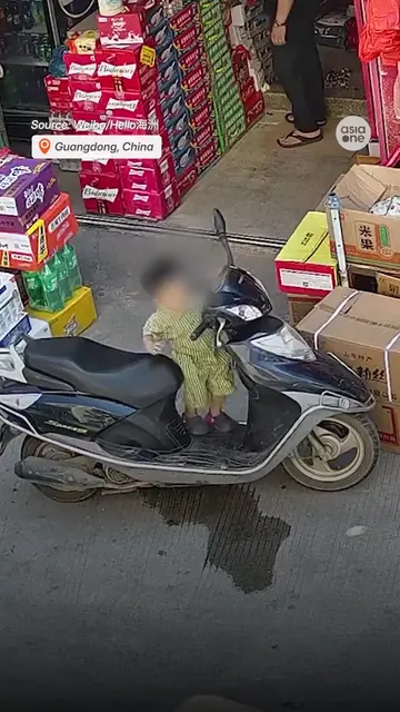 A terrifying near-miss was caught on camera after a young boy mounted an idling 