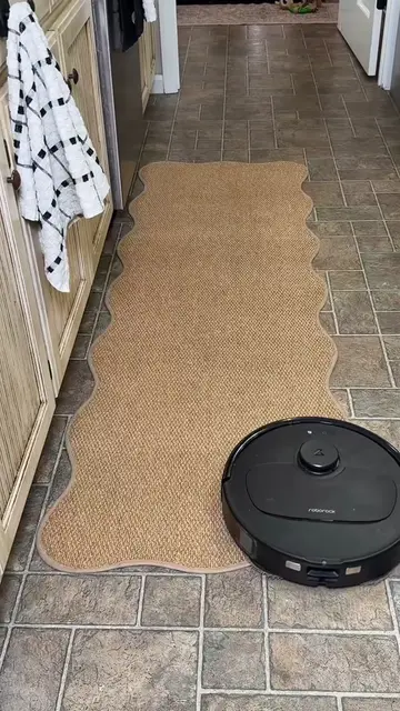 The perfect kitchen runner. She is affordable, cute, machine washable, and non s