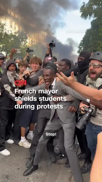 The mayor of a Parisian suburb was seen stepping between protesting students and
