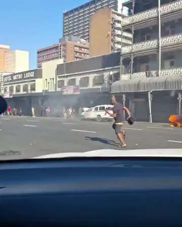 Thick black smoke engulfed Dr Pixley KaSeme Street on Thursday after March and M