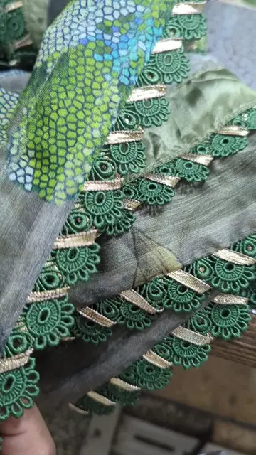 Crafting elegance with wide lace, magzi, and gota attached all around the dupatt