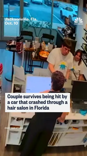 A couple in Florida survives being hit by a car that crashed through a hair salo