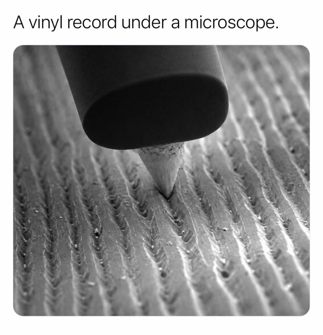 A vinyl record stores music as physical movement carved into one continuous spir