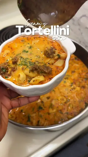 Creamy Tomato Tortellini Soup A cozy, hearty soup made with seasoned ground beef