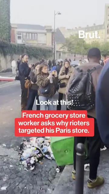 “What did we do to you?” A Paris grocery worker confronted a crowd outside his d